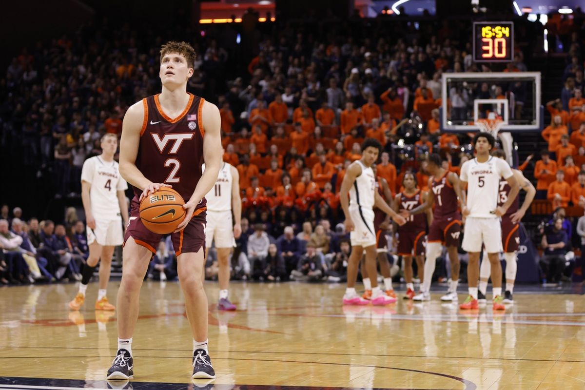 Feb 1, 2025; Charlottesville, Virginia, USA; Virginia Tech Hokies guard Jaden Schutt (2) takes a foul shot as the Virginia Cavaliers look on during the first half at John Paul Jones Arena. Mandatory Credit: Amber Searls-Imagn Images