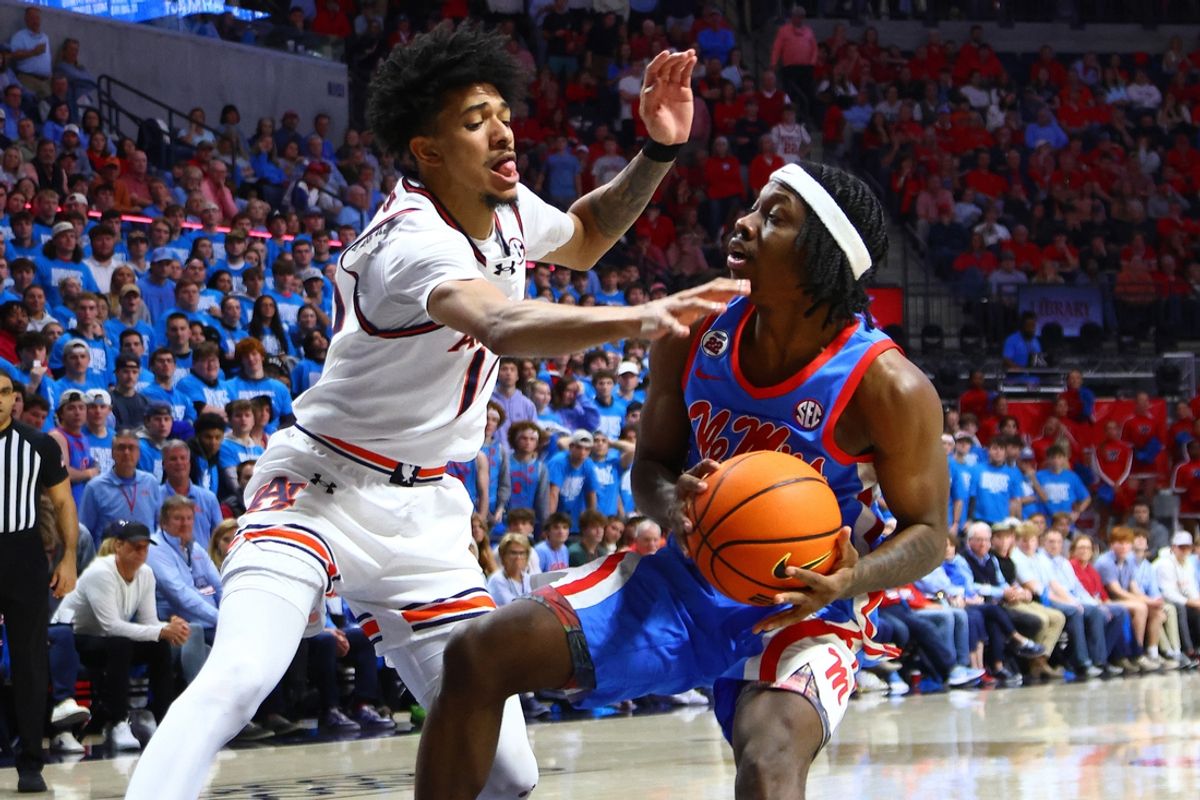 Feb 1, 2025; Oxford, Mississippi, USA; Mississippi Rebels guard Jaylen Murray (5) drives to the basket as Auburn Tigers guard Chad Baker-Mazara (10) defends during the second half at The Sandy and John Black Pavilion at Ole Miss. Mandatory Credit: Petre Thomas-Imagn Images