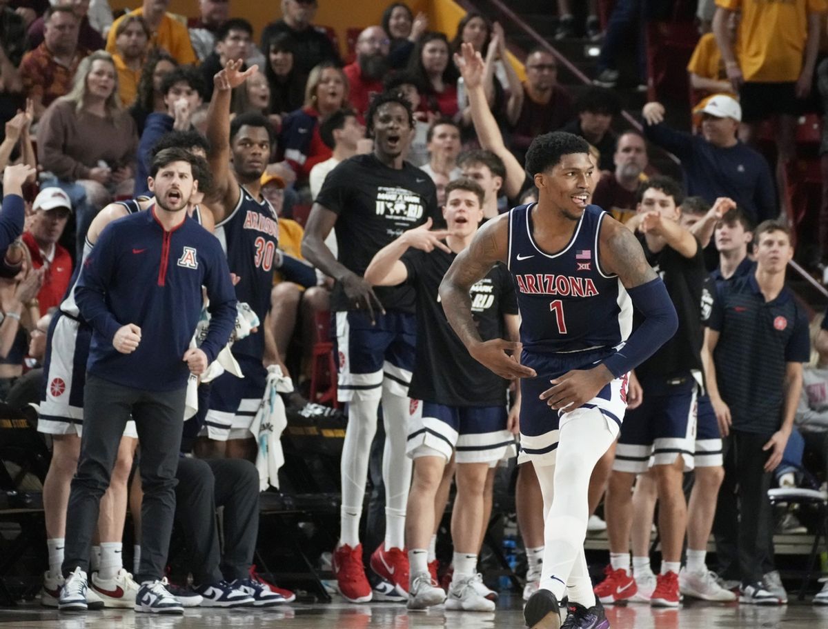 Feb 1, 2025; Tempe, Ariz., U.S.; Arizona Wildcats guard Caleb Love (1) reacts after sinking a 3-point shot during a Big 12 men's basketball game against the Arizona State Sun Devils at Desert Financial Arena.