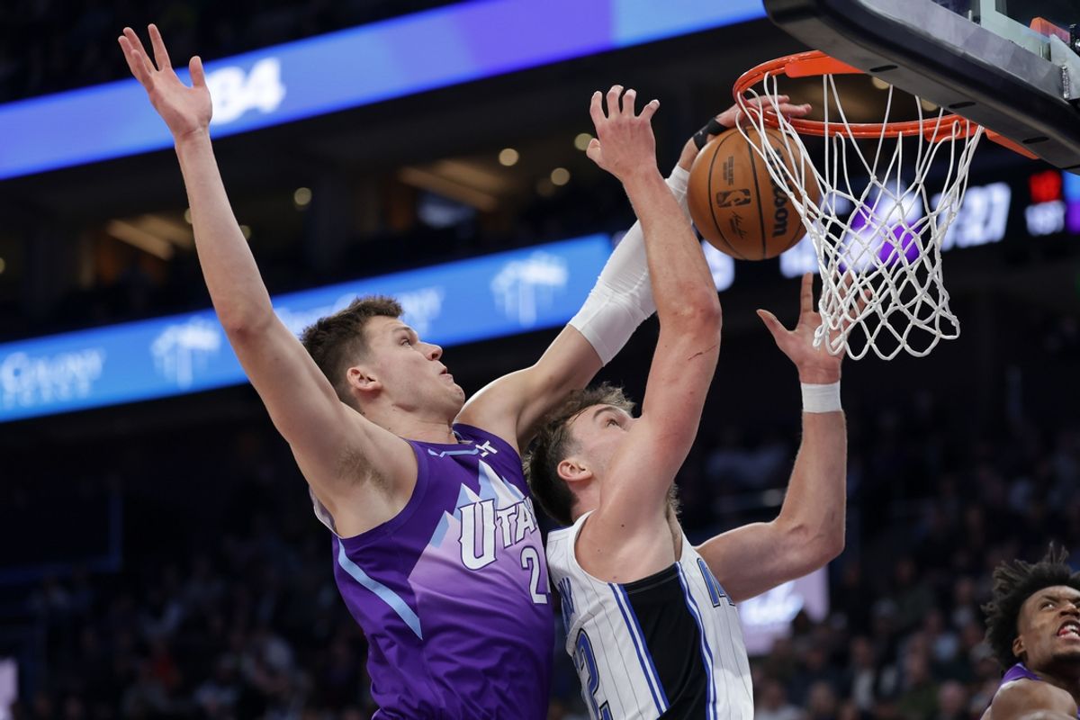 Feb 1, 2025; Salt Lake City, Utah, USA;  Utah Jazz center Walker Kessler (24) blocks the shot of Orlando Magic forward Franz Wagner (22) during the first quarter at Delta Center. Mandatory Credit: Chris Nicoll-Imagn Images