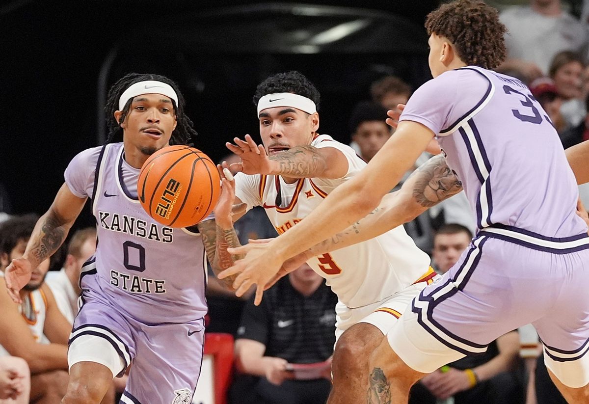 Iowa State Cyclones guard Tamin Lipsey (3) tries to steal the ball between Kansas State Wildcats' guard Dug McDaniel (0) and forward Coleman Hawkins (33) during the first half in the Big-12 men’s basketball showdown at Hilton Coliseum on Feb 1, 2025 in Ames, Iowa.