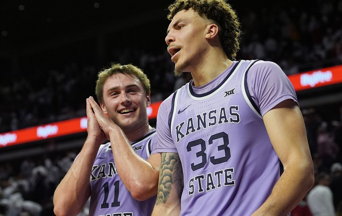 Kansas State Wildcats' guard Brendan Hausen (11) and forward Coleman Hawkins (33) celebrates after winning 61-80 over Iowa State in the Big-12 men’s basketball showdown at Hilton Coliseum on Feb 1, 2025 in Ames, Iowa.