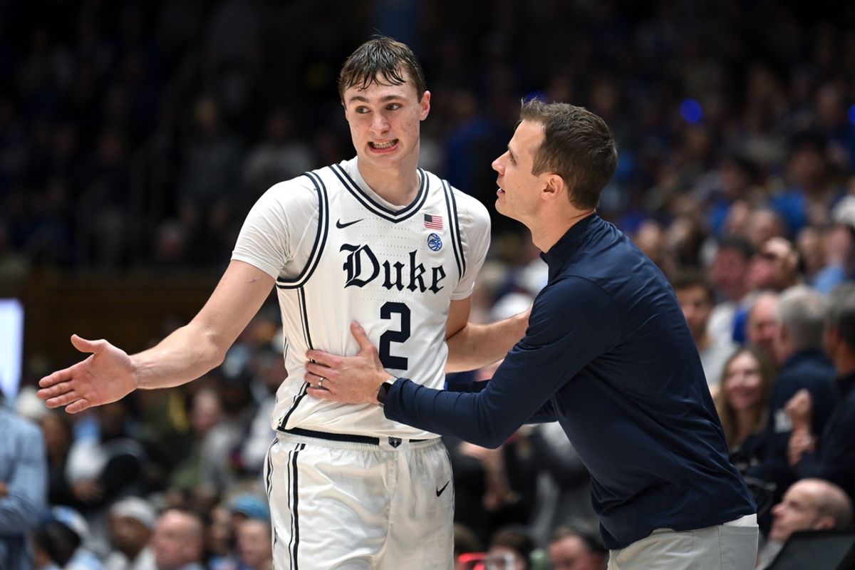 Feb 1, 2025; Durham, North Carolina, USA;  Duke Blue Devils head coach Jon Scheyer talks with forward Cooper Flagg (2) in the second half against the North Carolina Tar Heels at Cameron Indoor Stadium. Mandatory Credit: Zachary Taft-Imagn Images