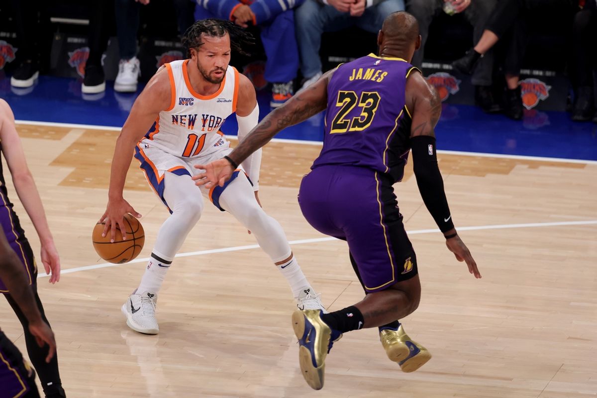 Feb 1, 2025; New York, New York, USA; New York Knicks guard Jalen Brunson (11) controls the ball against Los Angeles Lakers forward LeBron James (23) during the first quarter at Madison Square Garden. Mandatory Credit: Brad Penner-Imagn Images