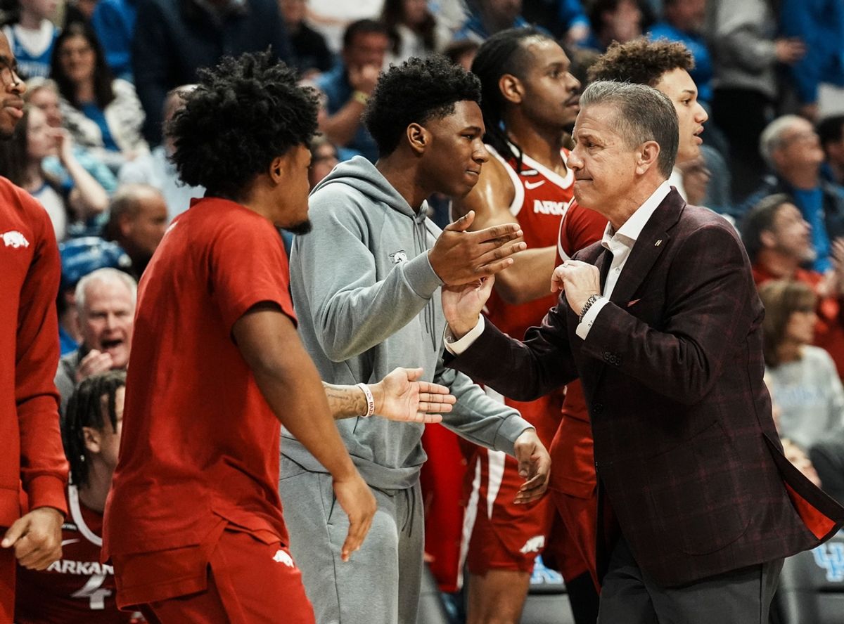 Arkansas head coach John Calipari gives high fives to his team as the Razorbacks took the half time lead over Kentucky Saturday Feb. 1, 2025 at Rupp Arena in Lexington, Kentucky.