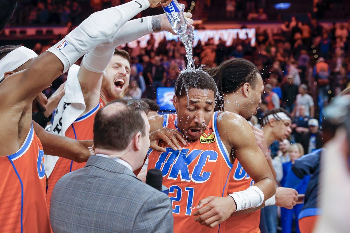 Feb 1, 2025; Oklahoma City, Oklahoma, USA; Oklahoma City Thunder guard Aaron Wiggins (21) gets water poured on him by his teammates after his performance against the Sacramento Kings during the second half at Paycom Center. Mandatory Credit: Alonzo Adams-Imagn Images