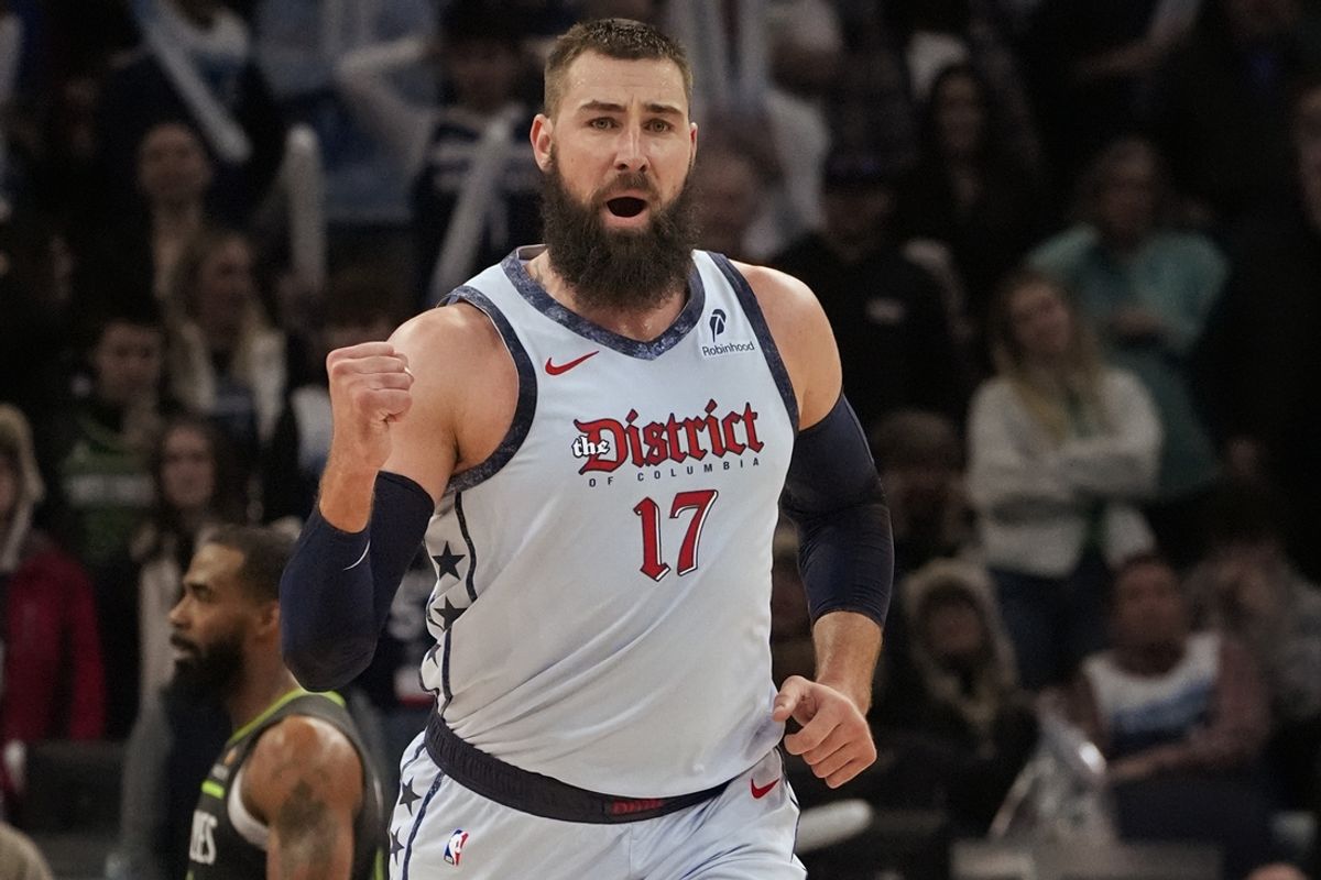 Feb 1, 2025; Minneapolis, Minnesota, USA; Washington Wizards center Jonas Valanciunas (17) celebrates his basket against the Minnesota Timberwolves with less than 20 seconds to go in the fourth quarter at Target Center. Mandatory Credit: Bruce Kluckhohn-Imagn Images