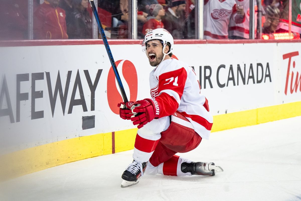Feb 1, 2025; Calgary, Alberta, CAN; Detroit Red Wings center Dylan Larkin (71) celebrates after scoring a goal against the Calgary Flames during the first period at Scotiabank Saddledome. Mandatory Credit: Brett Holmes-Imagn Images