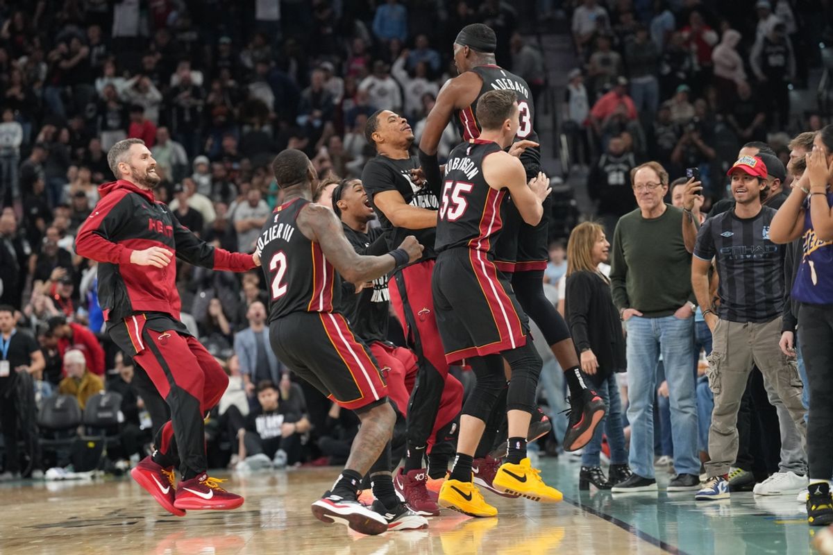 Feb 1, 2025; San Antonio, Texas, USA; Miami Heat players celebrate after center Bam Adebayo (13) scored the winning basket at the end of the game to defeat the San Antonio Spurs at Frost Bank Center. Mandatory Credit: Scott Wachter-Imagn Images