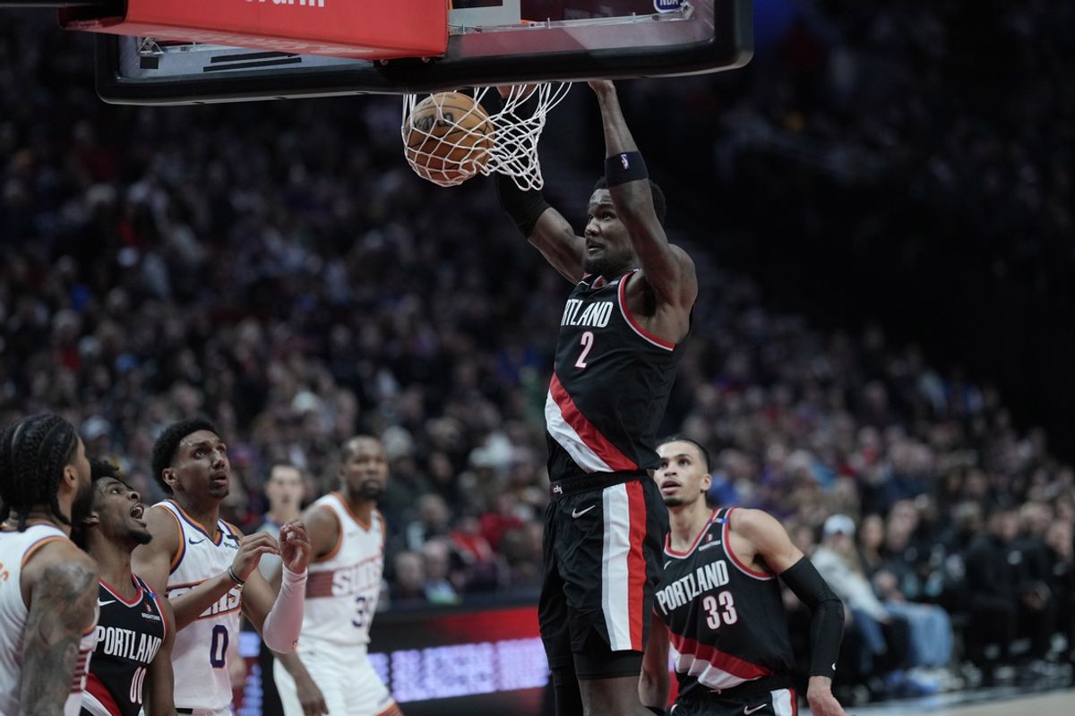 Feb 1, 2025; Portland, Oregon, USA; Portland Trail Blazers center Deandre Ayton (2) dunks the ball during the second half against the Phoenix Suns at Moda Center. Mandatory Credit: Soobum Im-Imagn Images