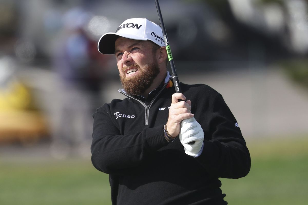 Feb 2, 2025; Pebble Beach, California, USA; Shane Lowry hits his second shot on the fourth hole during the final round of the AT&T Pebble Beach Pro-Am golf tournament at Pebble Beach Golf Links. Mandatory Credit: Kiyoshi Mio-Imagn Images