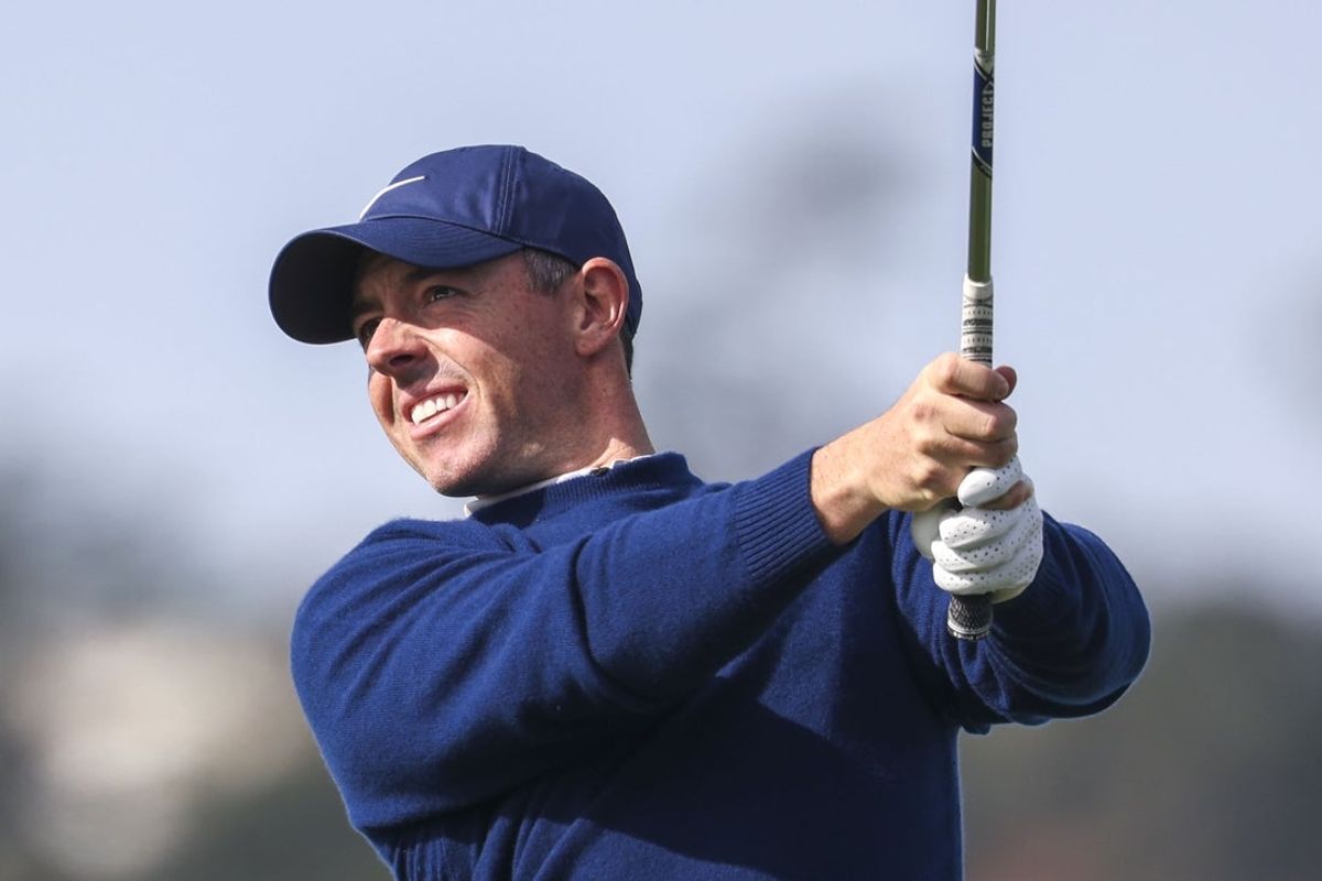 Feb 2, 2025; Pebble Beach, California, USA; Rory McIlroy hits his tee shot on the fifth hole during the final round of the AT&T Pebble Beach Pro-Am golf tournament at Pebble Beach Golf Links. Mandatory Credit: Kiyoshi Mio-Imagn Images