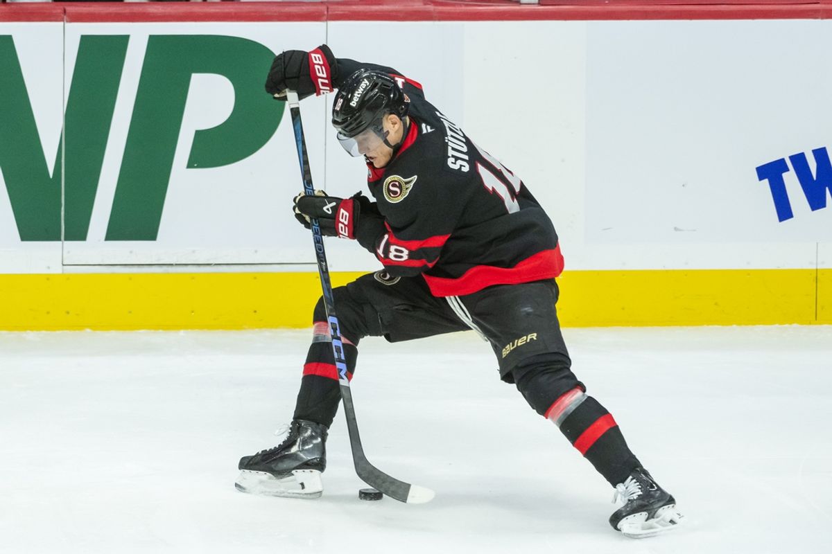 Feb 1, 2025; Ottawa, Ontario, CAN; Ottawa Senators center Tim Stutzles (18) moves the puck in the third period against the Minnesota Wild at the Canadian Tire Centre. Mandatory Credit: Marc DesRosiers-Imagn Images