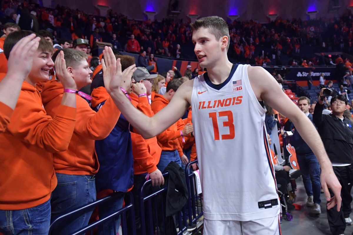 Feb 2, 2025; Champaign, Illinois, USA; Illinois Fighting Illini center Tomislav Ivisic (13) gets a hand from fans after an 87-79 win over the Ohio State Buckeyes at State Farm Center. Mandatory Credit: Ron Johnson-Imagn Images