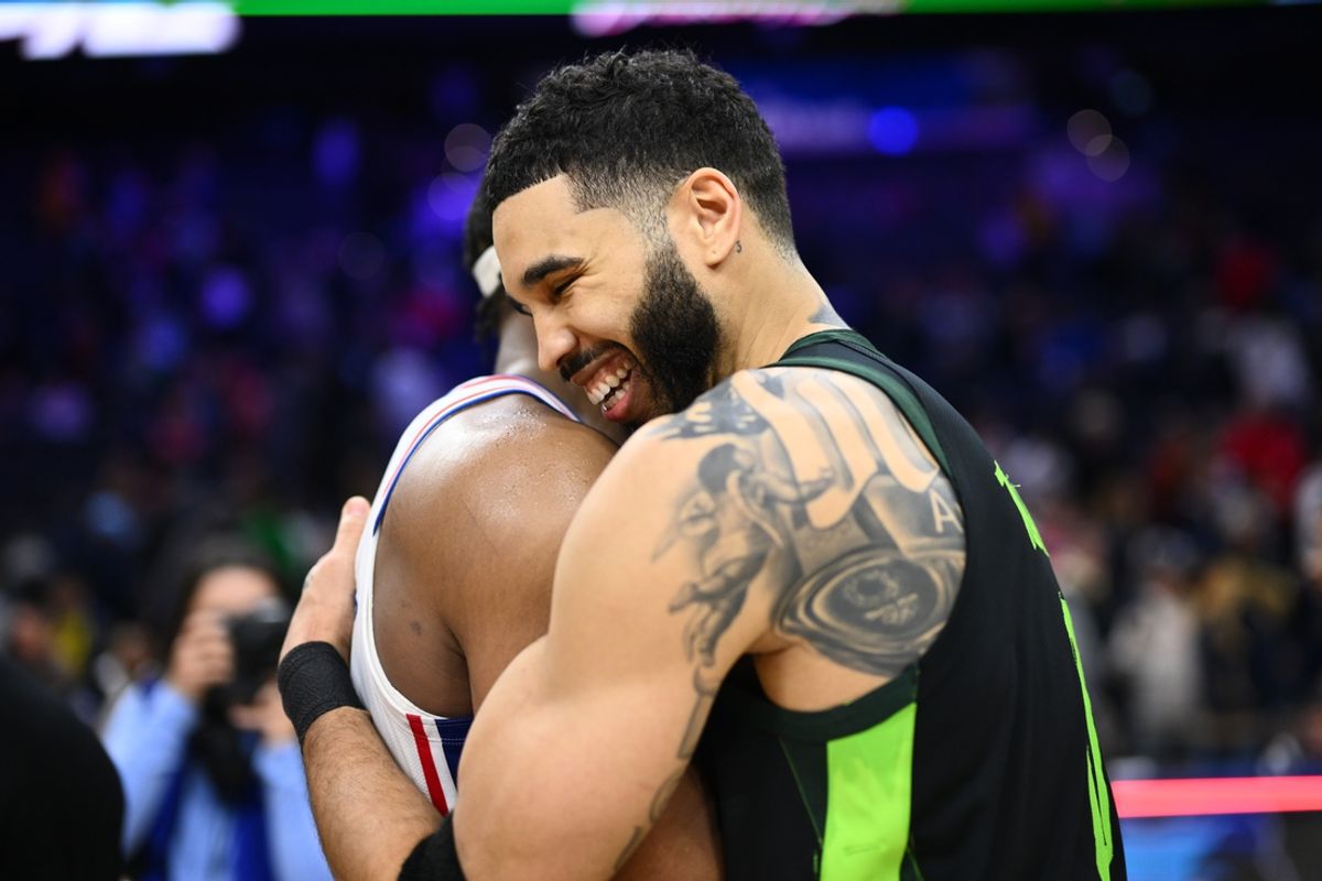 Feb 2, 2025; Philadelphia, Pennsylvania, USA; Boston Celtics forward Jayson Tatum (0) reacts with Philadelphia 76ers forward Guerschon Yabusele (28) after the game at Wells Fargo Center. Mandatory Credit: Kyle Ross-Imagn Images