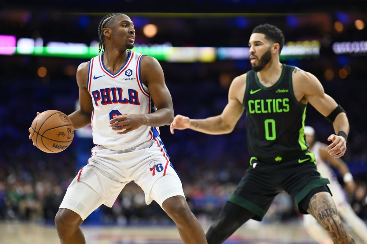Feb 2, 2025; Philadelphia, Pennsylvania, USA; Philadelphia 76ers guard Tyrese Maxey (0) controls the ball against Boston Celtics forward Jayson Tatum (0) in the fourth quarter at Wells Fargo Center. Mandatory Credit: Kyle Ross-Imagn Images
