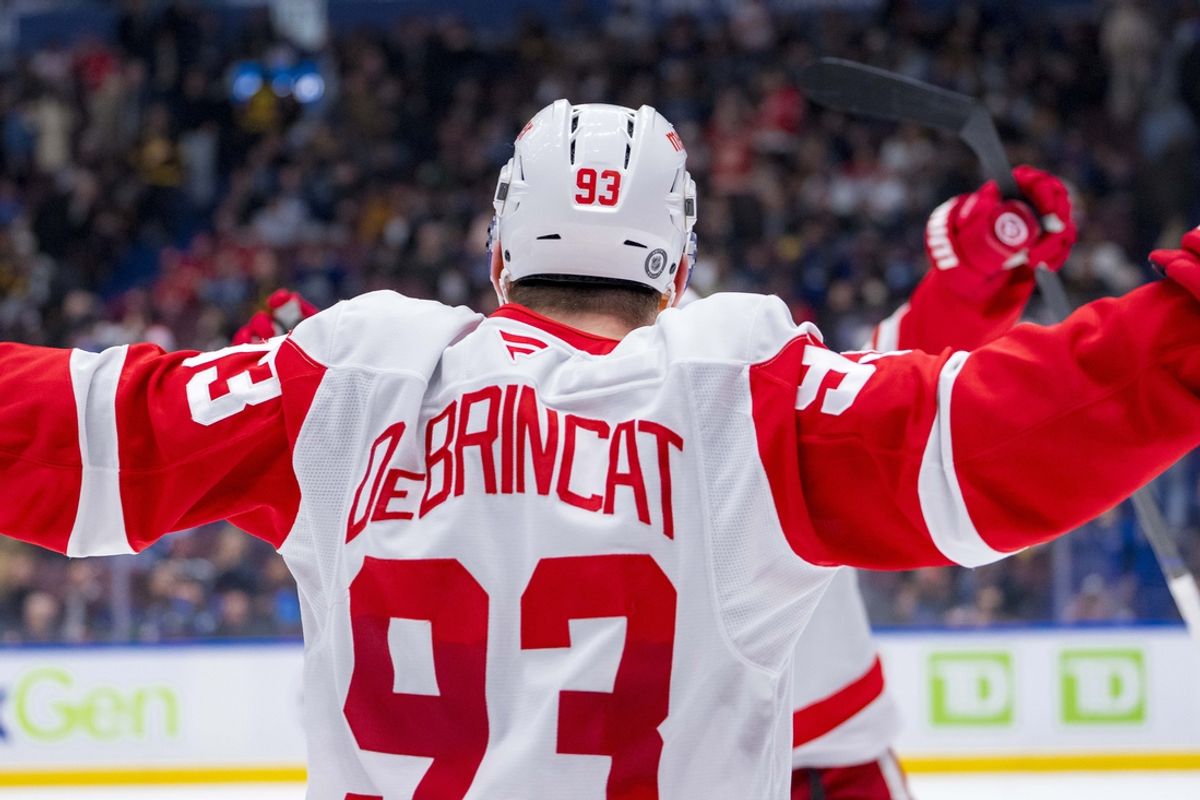 Feb 2, 2025; Vancouver, British Columbia, CAN; Detroit Red Wings forward Alex DeBrincat (93) celebrates his overtime goal against the Vancouver Canucks at Rogers Arena. Mandatory Credit: Bob Frid-Imagn Images