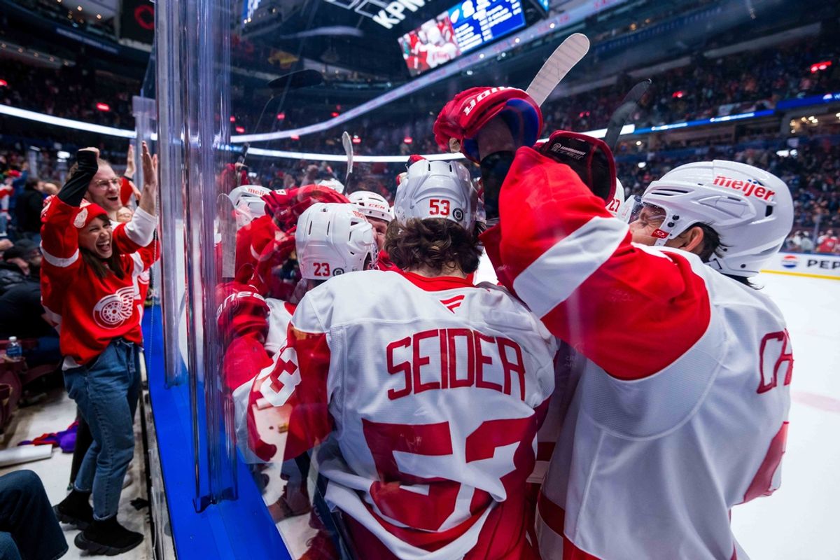 Feb 2, 2025; Vancouver, British Columbia, CAN; Fans and the Detroit Red Wings celebrate their overtime victory against the Vancouver Canucks at Rogers Arena. Mandatory Credit: Bob Frid-Imagn Images