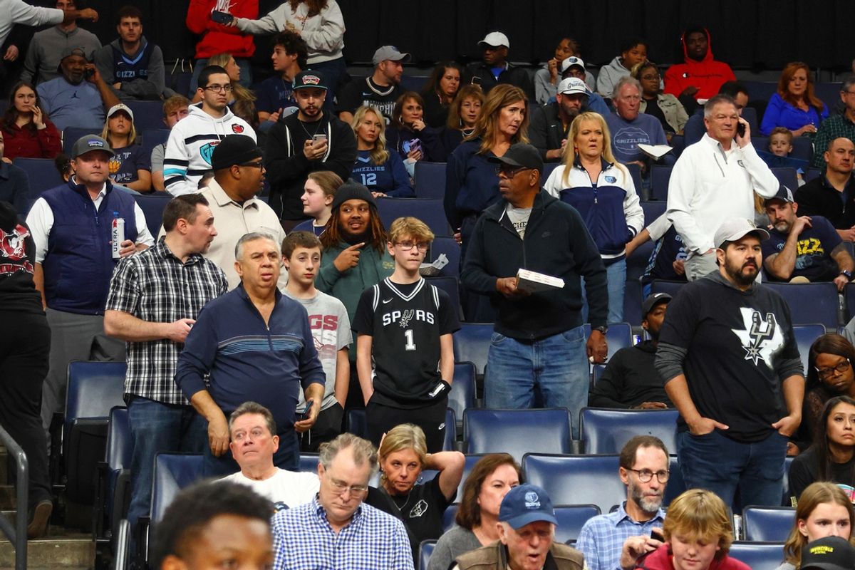 Feb 3, 2025; Memphis, Tennessee, USA; Fans look on after a delayed start to the game, as medical personnel check on a fan before the game between the San Antonio Spurs and  the Memphis Grizzlies at FedExForum. Mandatory Credit: Petre Thomas-Imagn Images