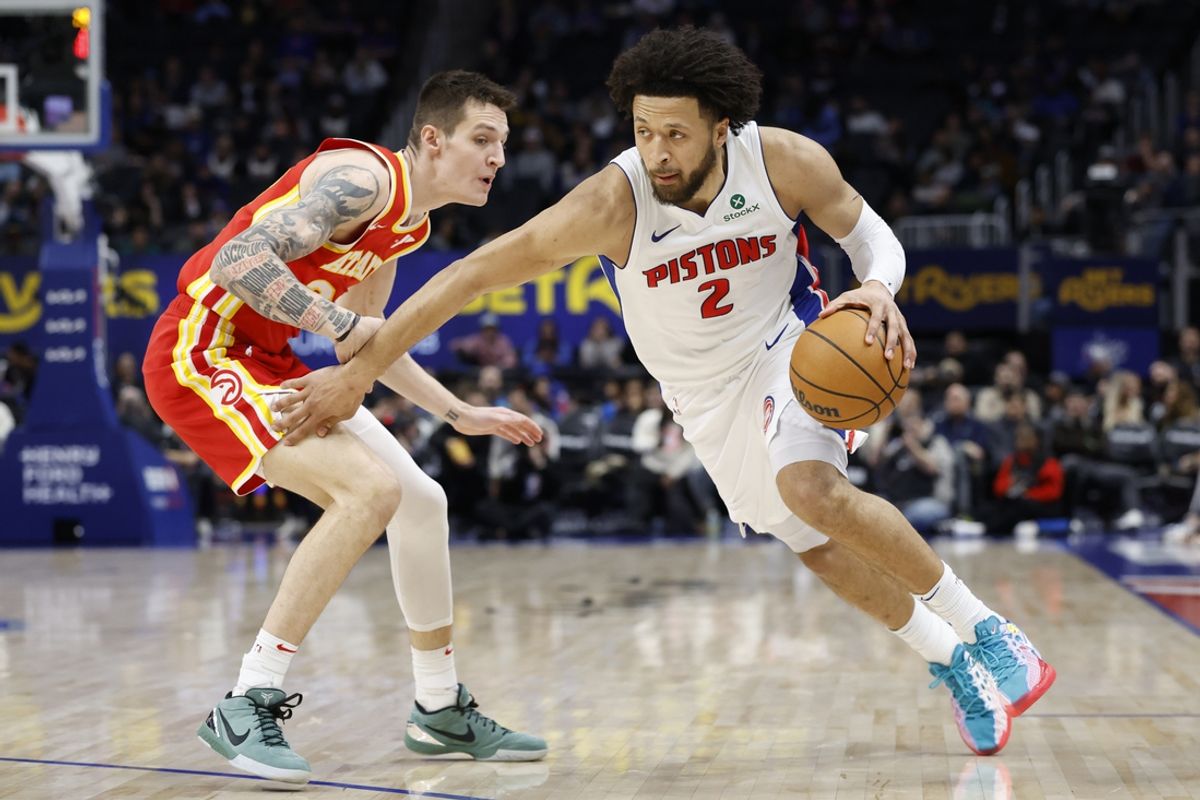 Feb 3, 2025; Detroit, Michigan, USA;  Detroit Pistons guard Cade Cunningham (2) is defended by Atlanta Hawks guard Vit Krejci (27) in the first half against the Atlanta Hawks at Little Caesars Arena. Mandatory Credit: Rick Osentoski-Imagn Images