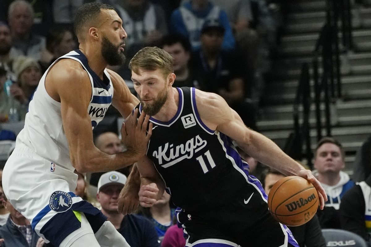 Feb 3, 2025; Minneapolis, Minnesota, USA; Sacramento Kings center Domantas Sabonis (11) works against Minnesota Timberwolves center Rudy Gobert (27) in the first quarter at Target Center. Mandatory Credit: Bruce Kluckhohn-Imagn Images
