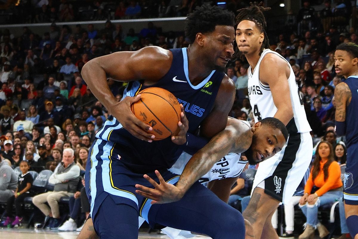 Feb 3, 2025; Memphis, Tennessee, USA; Memphis Grizzlies forward Jaren Jackson Jr. (13) drives to the basket as San Antonio Spurs guard Blake Wesley (14) defends during the second quarter at FedExForum. Mandatory Credit: Petre Thomas-Imagn Images