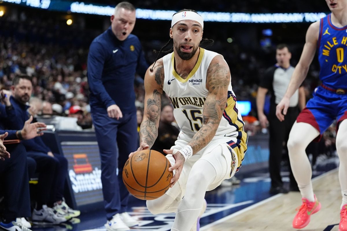 Feb 3, 2025; Denver, Colorado, USA; New Orleans Pelicans guard Jose Alvarado (15) reaches for a loose ball in the second quarter against the Denver Nuggets at Ball Arena. Mandatory Credit: Ron Chenoy-Imagn Images