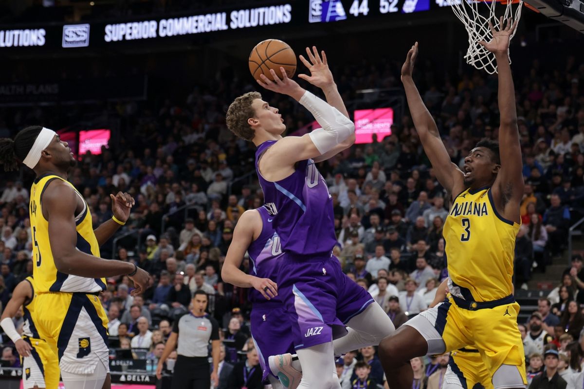 Feb 3, 2025; Salt Lake City, Utah, USA;  Utah Jazz forward Lauri Markkanen (23) shoots the ball over the arms of Indiana Pacers center Thomas Bryant (3) during the second quarter at Delta Center. Mandatory Credit: Chris Nicoll-Imagn Images