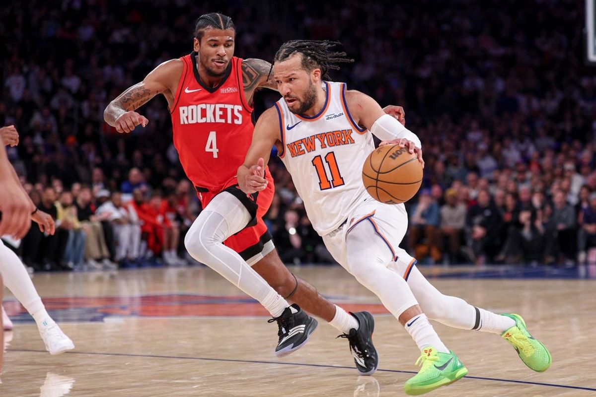 Feb 3, 2025; New York, New York, USA; New York Knicks guard Jalen Brunson (11) goes to the basket as Houston Rockets guard Jalen Green (4) defends during the second half at Madison Square Garden. Mandatory Credit: Vincent Carchietta-Imagn Images