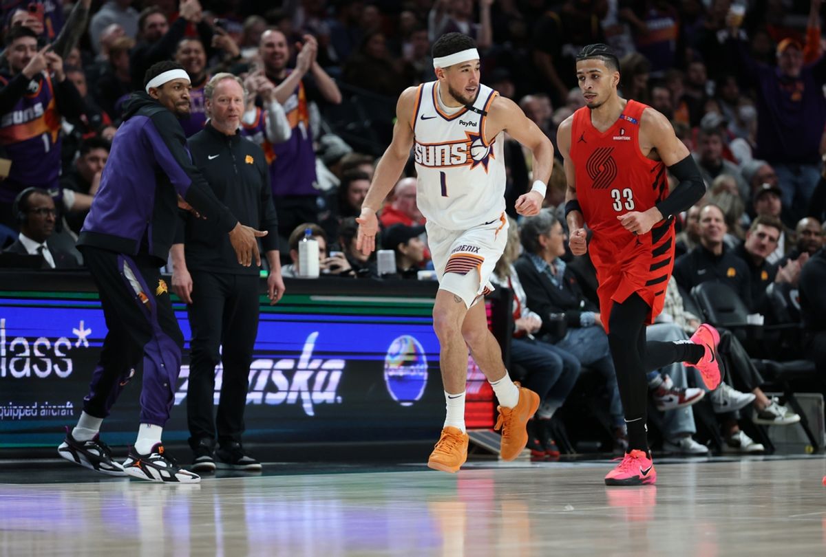 Feb 3, 2025; Portland, Oregon, USA; Phoenix Suns guard Devin Booker (1) reacts after scoring against the Portland Trail Blazers to make Booker the Suns’ all-time leading scorer in the second half at Moda Center. Mandatory Credit: Jaime Valdez-Imagn Images