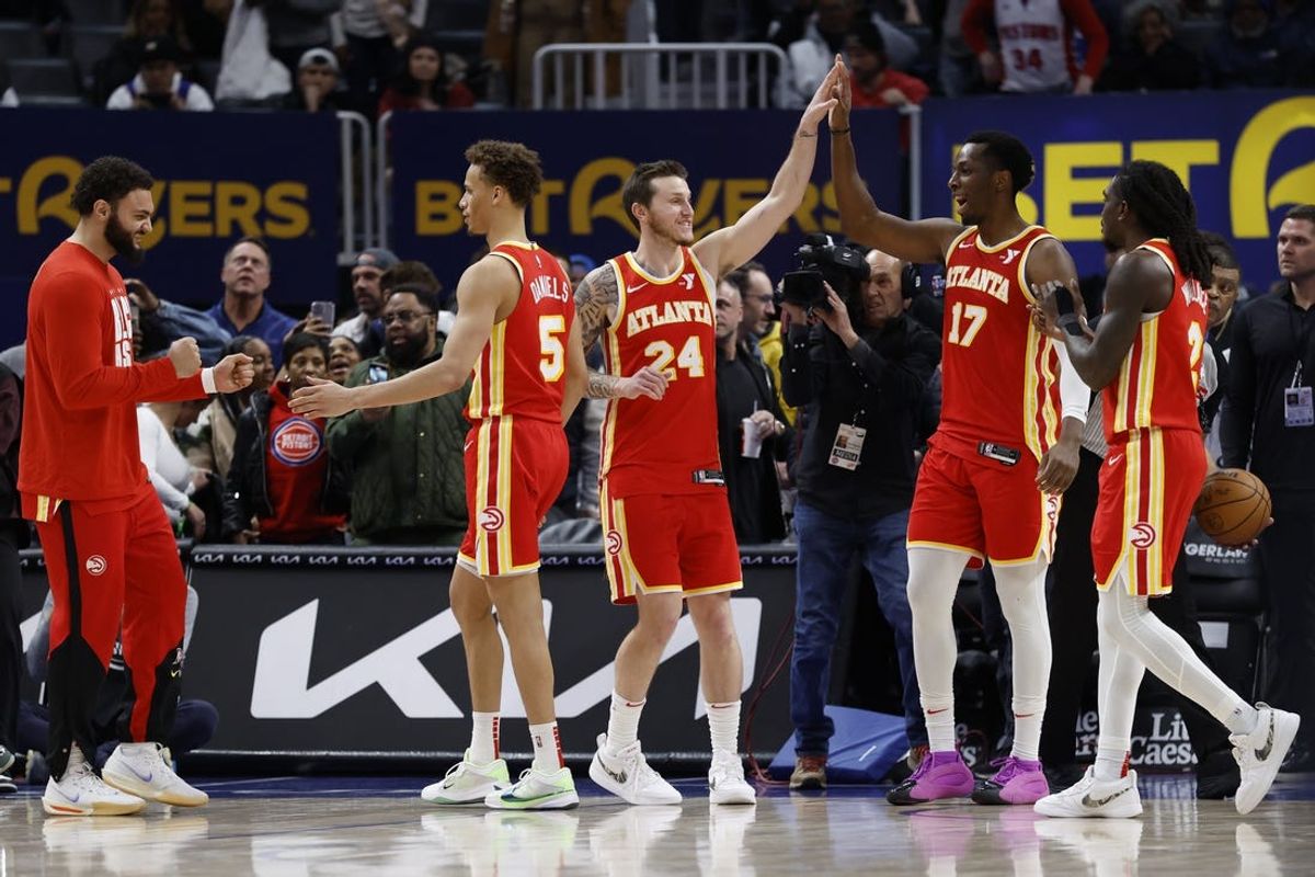 Feb 3, 2025; Detroit, Michigan, USA;  Atlanta Hawks celebrate after defeating the Detroit Pistons at Little Caesars Arena. Mandatory Credit: Rick Osentoski-Imagn Images