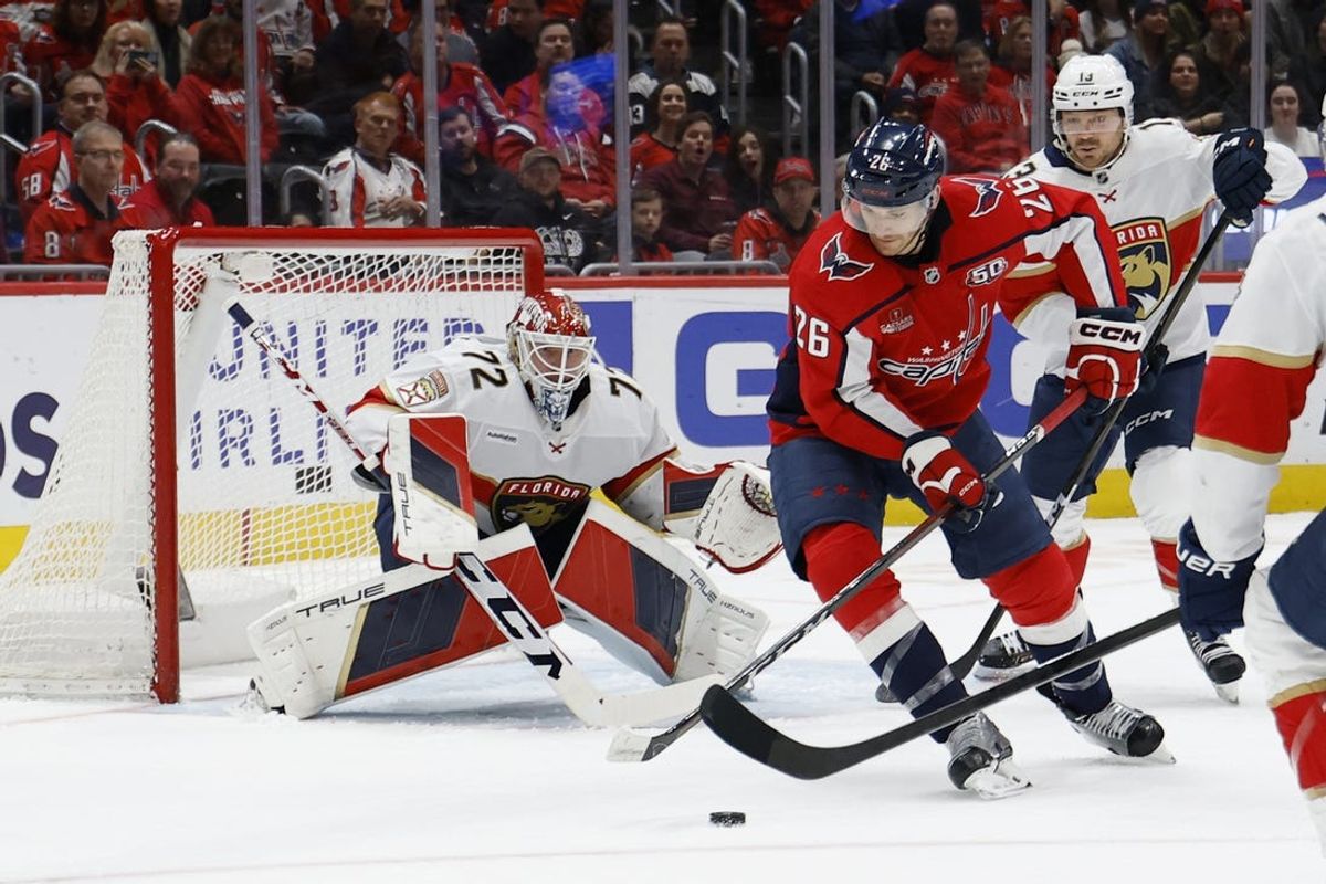 Feb 4, 2025; Washington, District of Columbia, USA; Florida Panthers goaltender Sergei Bobrovsky (72) prepares to make a save on Washington Capitals center Nic Dowd (26) in the first period at Capital One Arena. Mandatory Credit: Geoff Burke-Imagn Images