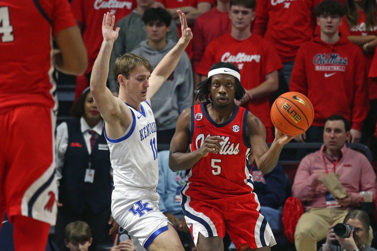 Feb 4, 2025; Oxford, Mississippi, USA; Mississippi Rebels guard Jaylen Murray (5) passes the ball as Kentucky Wildcats guard Travis Perry (11) defends during the first half at The Sandy and John Black Pavilion at Ole Miss. Mandatory Credit: Petre Thomas-Imagn Images
