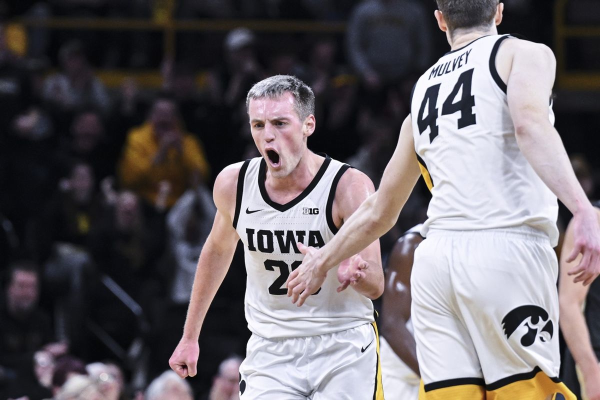 Feb 4, 2025; Iowa City, Iowa, USA; Iowa Hawkeyes forward Payton Sandfort (20) reacts with forward Riley Mulvey (44) against the Purdue Boilermakers during the first half at Carver-Hawkeye Arena. Mandatory Credit: Jeffrey Becker-Imagn Images