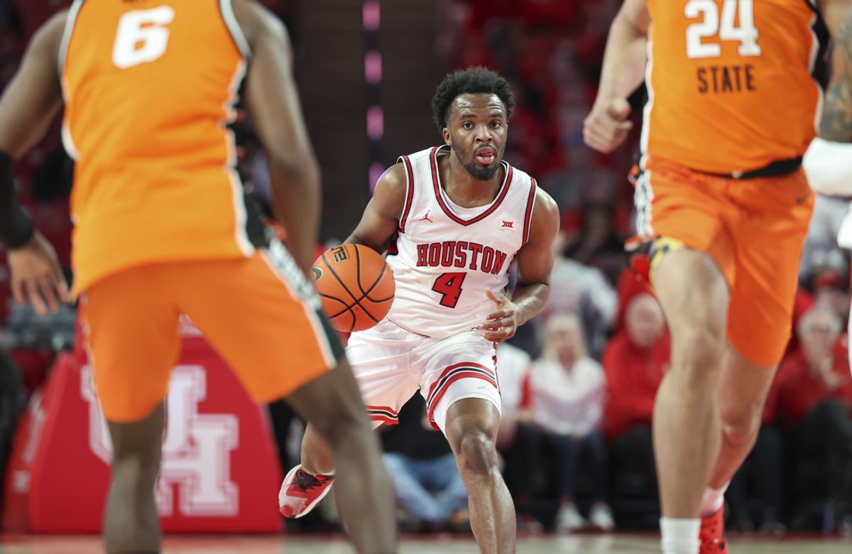 Feb 4, 2025; Houston, Texas, USA; Houston Cougars guard L.J. Cryer (4) advances the ball up the court during the first half against the Oklahoma State Cowboys at Fertitta Center. Mandatory Credit: Troy Taormina-Imagn Images