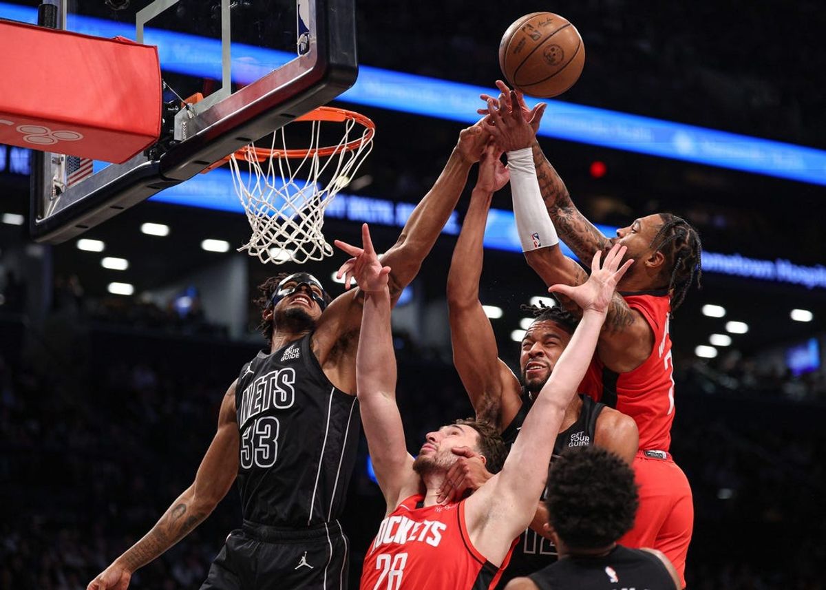 Feb 4, 2025; Brooklyn, New York, USA; Brooklyn Nets center Nic Claxton (33) and forward Tosan Evbuomwan (12) rebound against Houston Rockets center Alperen Sengun (28) and forward Cam Whitmore (7) during the first half at Barclays Center. Mandatory Credit: Vincent Carchietta-Imagn Images