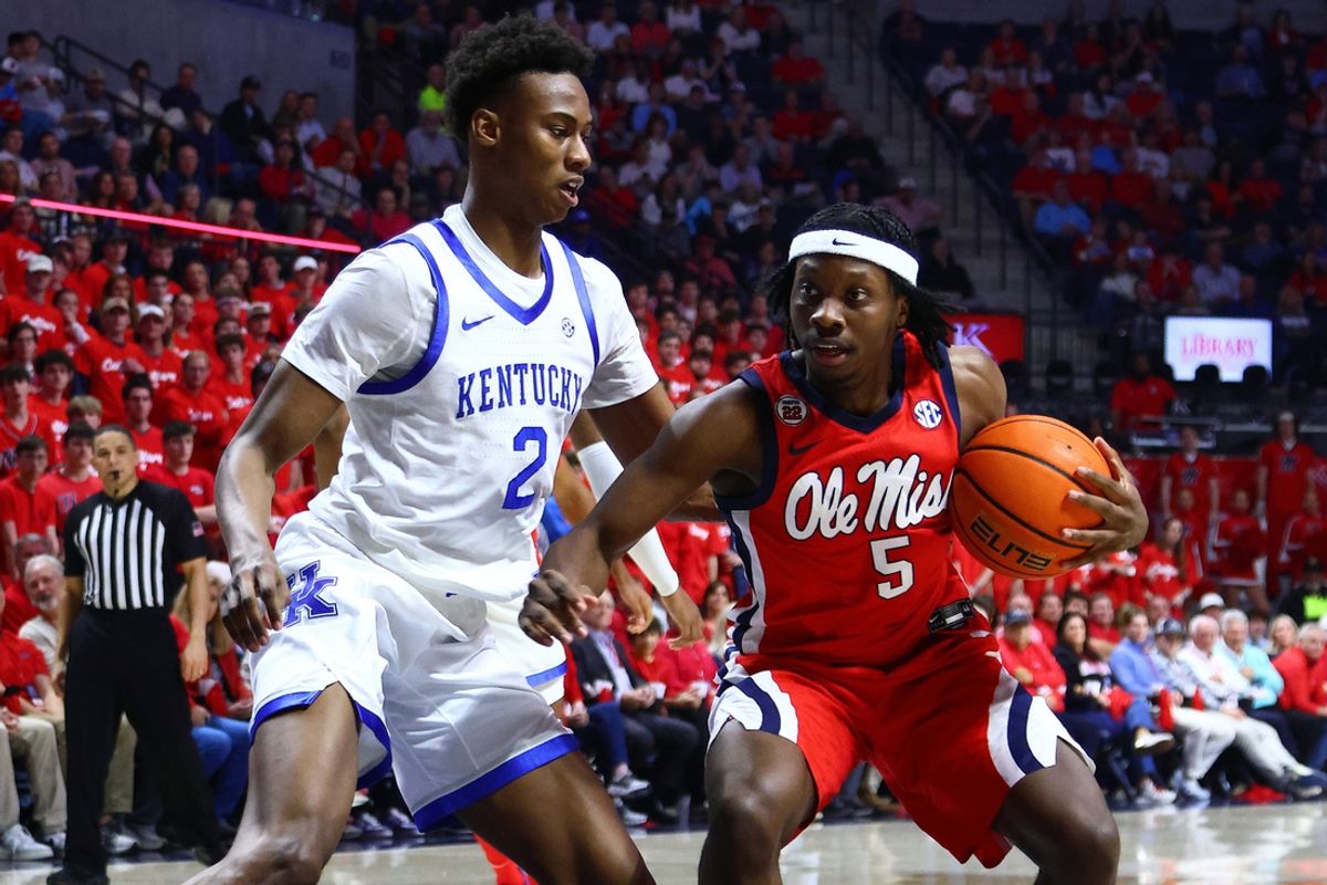Feb 4, 2025; Oxford, Mississippi, USA; Mississippi Rebels guard Jaylen Murray (5) drives to the basket as Kentucky Wildcats guard Jaxson Robinson (2) defends during the second half at The Sandy and John Black Pavilion at Ole Miss. Mandatory Credit: Petre Thomas-Imagn Images
