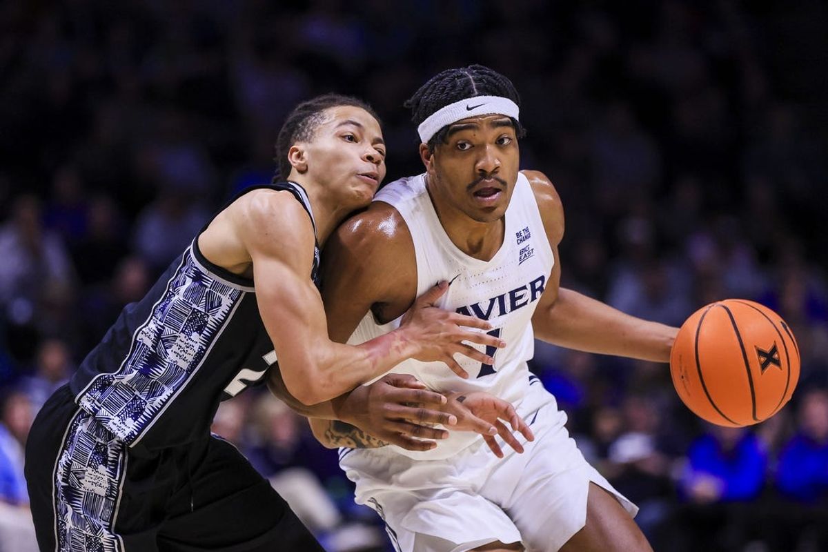 Feb 4, 2025; Cincinnati, Ohio, USA; Xavier Musketeers guard Marcus Foster (1) drives to the basket against Georgetown Hoyas guard Malik Mack (2) in the first half at Cintas Center. Mandatory Credit: Katie Stratman-Imagn Images