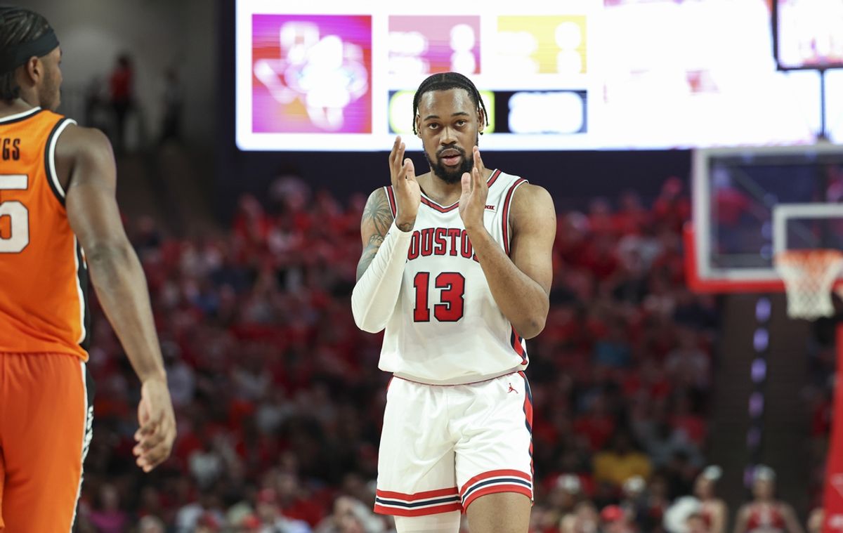Feb 4, 2025; Houston, Texas, USA; Houston Cougars forward J'Wan Roberts (13) claps after a play during the second half against the Oklahoma State Cowboys at Fertitta Center. Mandatory Credit: Troy Taormina-Imagn Images