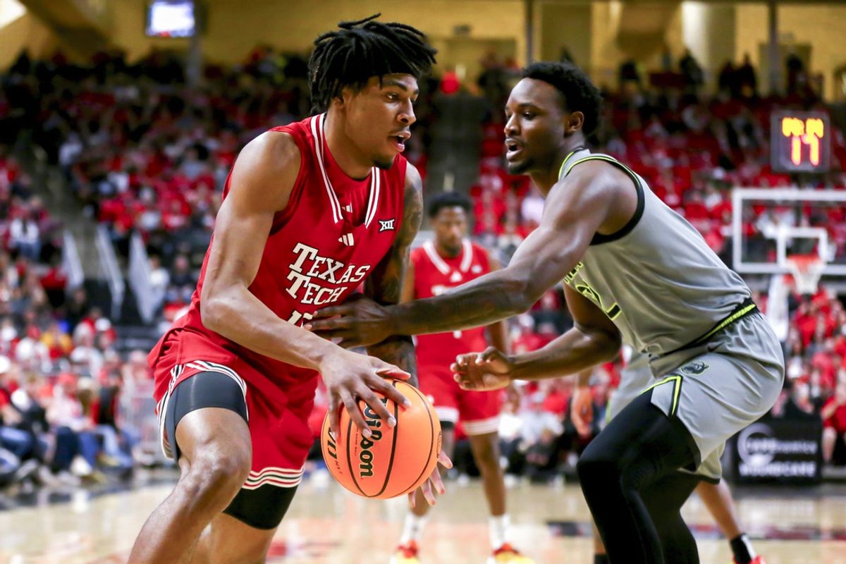 Feb 4, 2025; Lubbock, Texas, USA;  Texas Tech Red Raiders forward JT Toppin (15) dribbles the ball against Baylor Bears guard Jayden Nunn (2) in the first half at United Supermarkets Arena. Mandatory Credit: Michael C. Johnson-Imagn Images