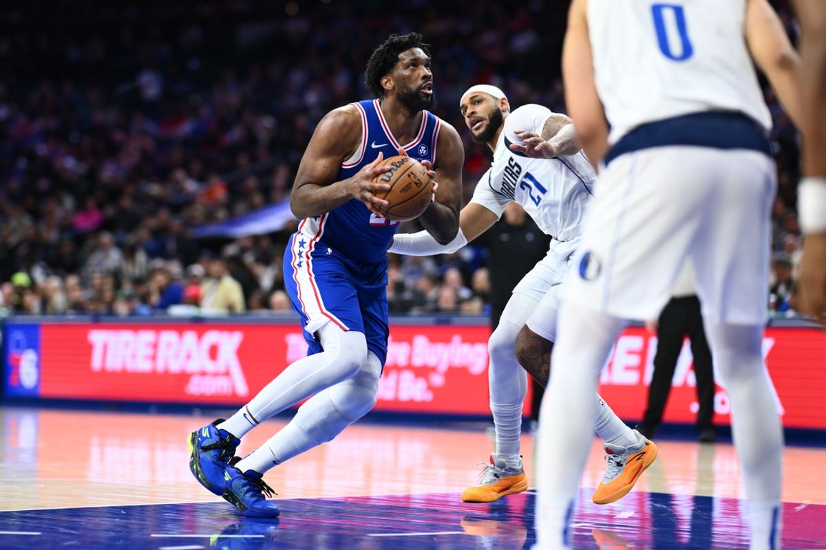 Feb 4, 2025; Philadelphia, Pennsylvania, USA; Philadelphia 76ers center Joel Embiid (21) drives against Dallas Mavericks forward Daniel Gafford (21) in the third quarter at Wells Fargo Center. Mandatory Credit: Kyle Ross-Imagn Images