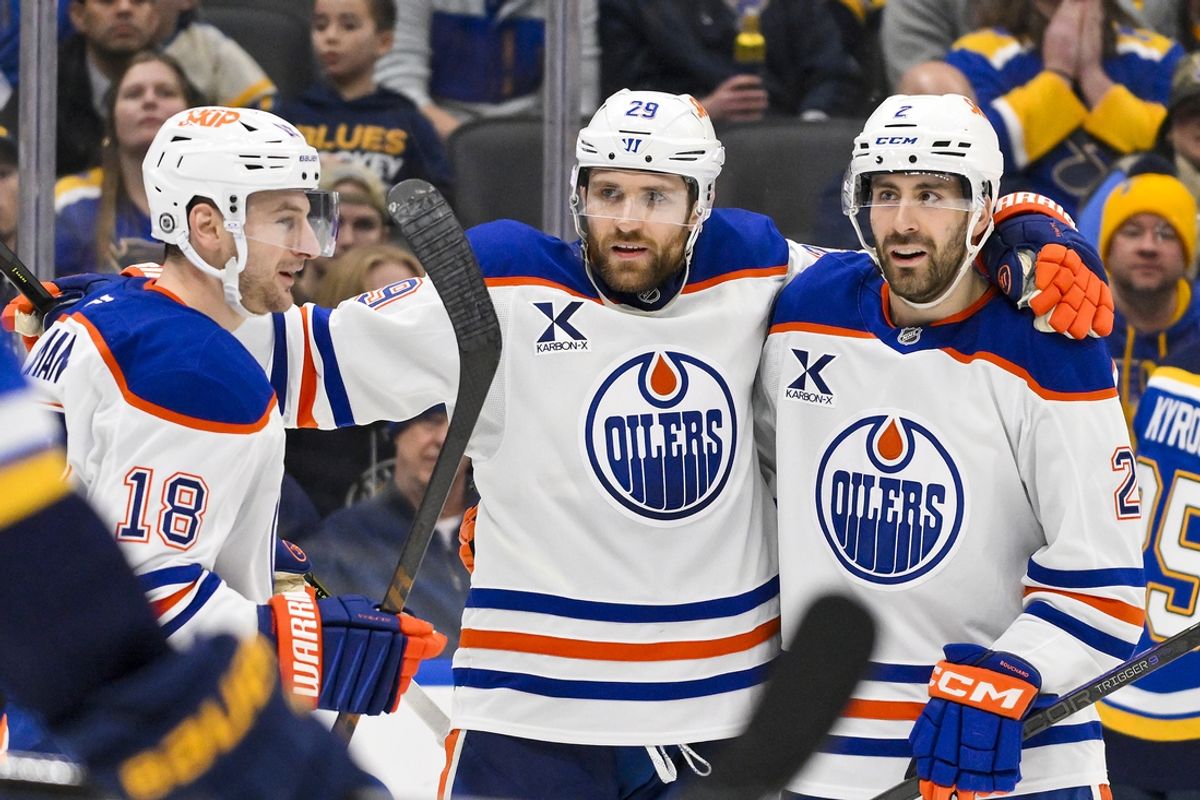 Feb 4, 2025; St. Louis, Missouri, USA;  Edmonton Oilers center Leon Draisaitl (29) is congratulated by defenseman Evan Bouchard (2) and left wing Zach Hyman (18) after scoring the game tying goal against the St. Louis Blues during the third period at Enterprise Center. Mandatory Credit: Jeff Curry-Imagn Images