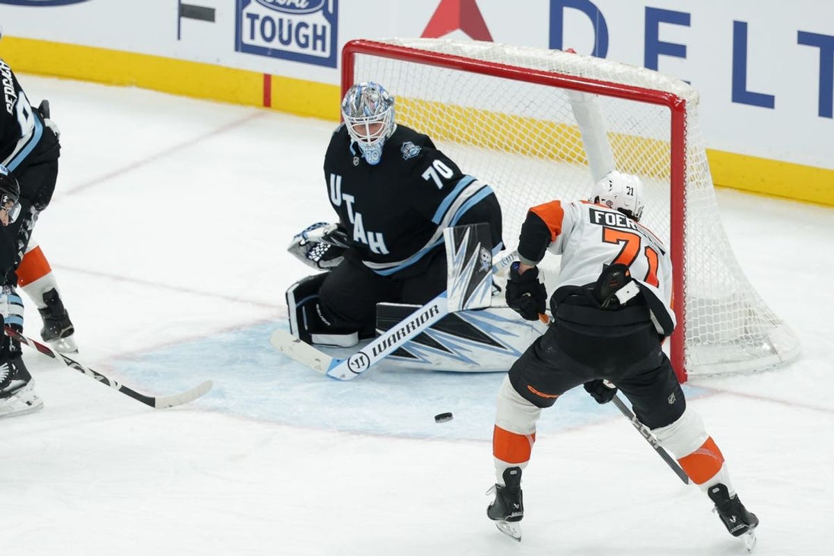 Feb 4, 2025; Salt Lake City, Utah, USA;  Philadelphia Flyers right wing Tyson Foerster (71) shoots the puck at Utah Hockey Club goaltender Karel Vejmelka (70) during the second period at Delta Center. Mandatory Credit: Chris Nicoll-Imagn Images