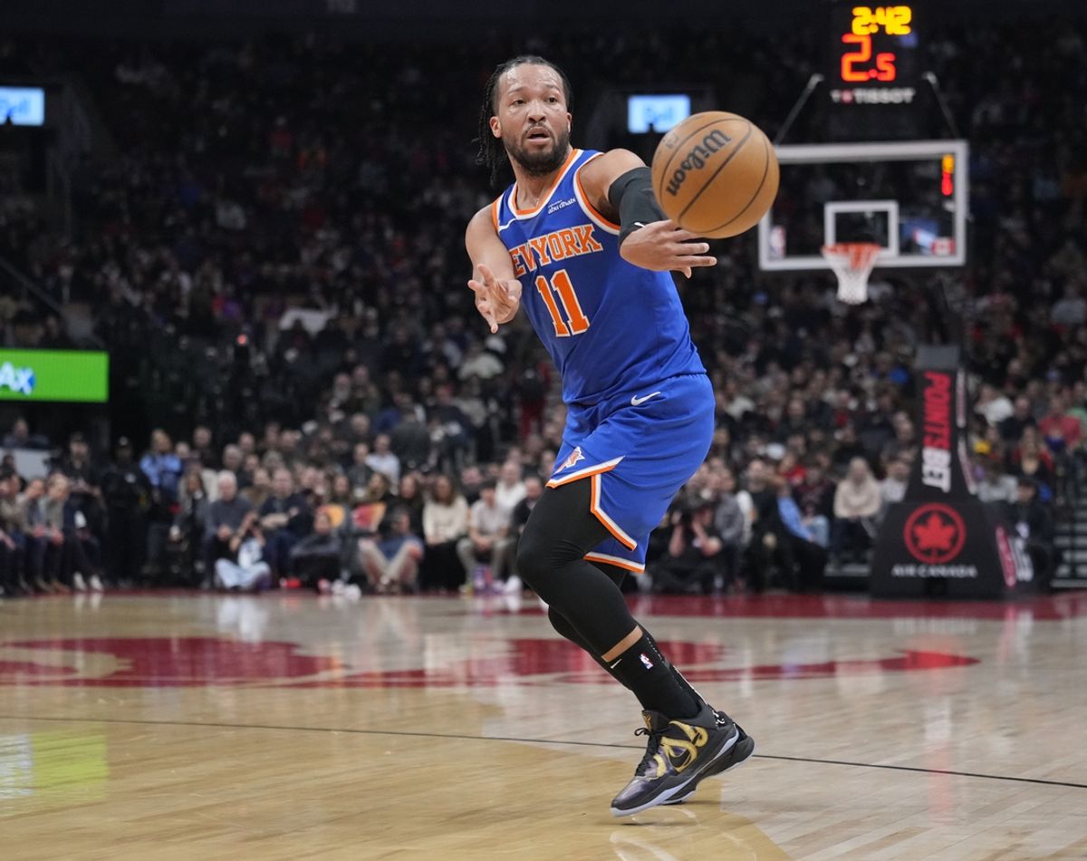 Feb 4, 2025; Toronto, Ontario, CAN; New York Knicks guard Jalen Brunson (11) passes off the ball during the first half against the Toronto Raptors at Scotiabank Arena. Mandatory Credit: John E. Sokolowski-Imagn Images
