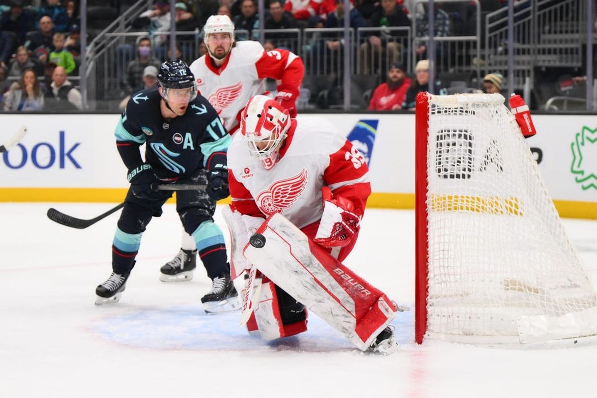 Feb 4, 2025; Seattle, Washington, USA; Detroit Red Wings goaltender Cam Talbot (39) blocks a Seattle Kraken goal shot during the second period at Climate Pledge Arena. Mandatory Credit: Steven Bisig-Imagn Images