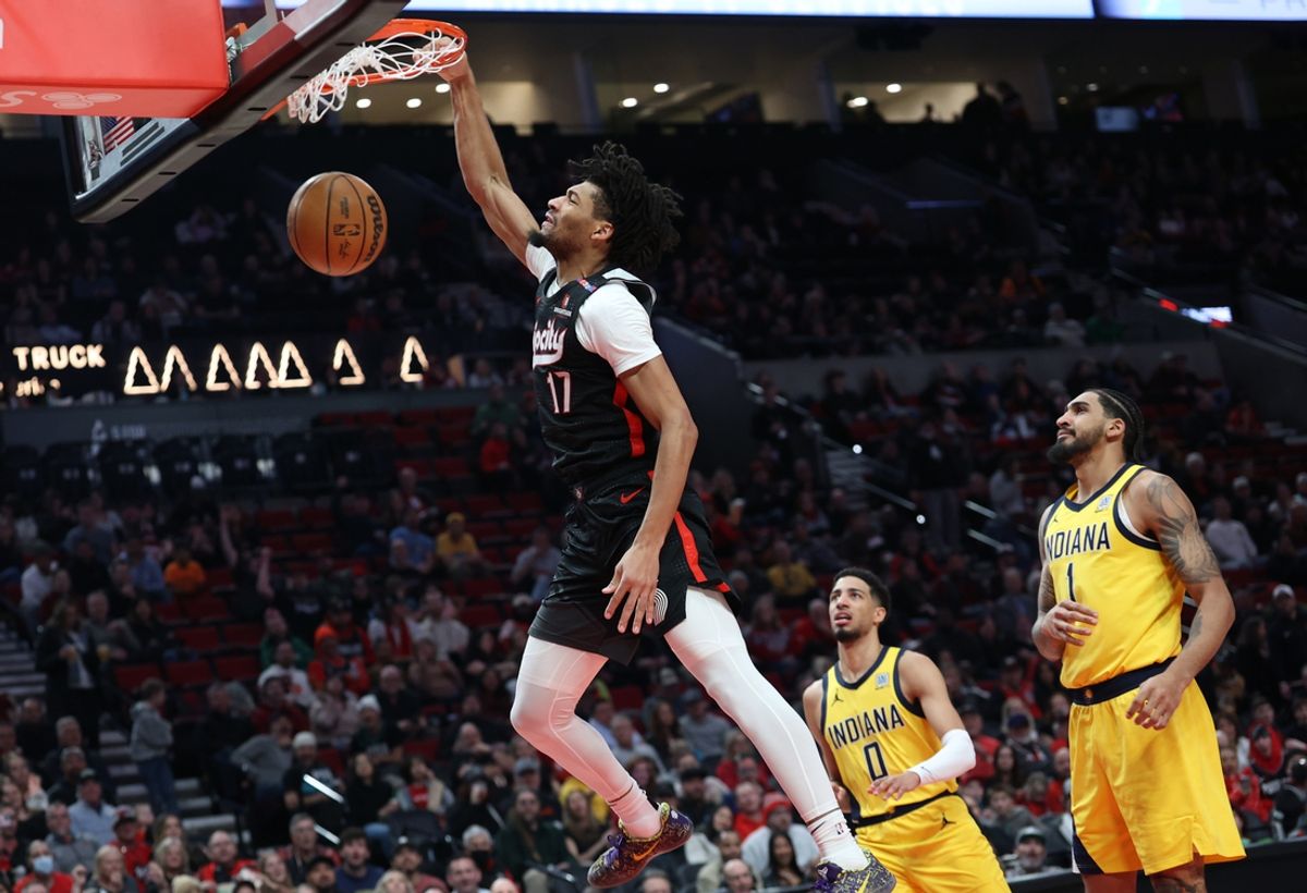 Feb 4, 2025; Portland, Oregon, USA; Portland Trail Blazers guard Shaedon Sharpe (17) dunks over Indiana Pacers guard Tyrese Haliburton (0) and Pacers’ forward Obi Toppin (1)  in the second half at Moda Center. Mandatory Credit: Jaime Valdez-Imagn Images