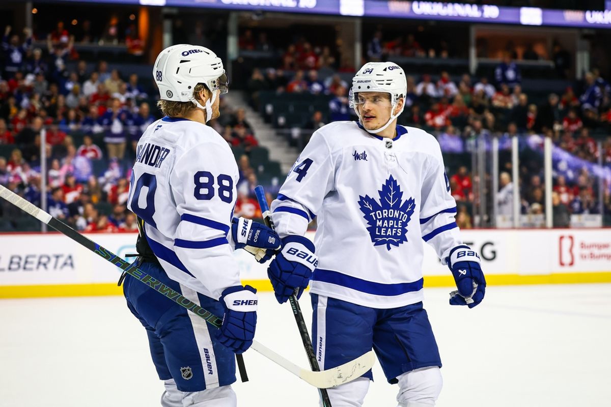 Feb 4, 2025; Calgary, Alberta, CAN; Toronto Maple Leafs right wing William Nylander (88) celebrates his goal with teammates against the Calgary Flames during the third period at Scotiabank Saddledome. Mandatory Credit: Sergei Belski-Imagn Images