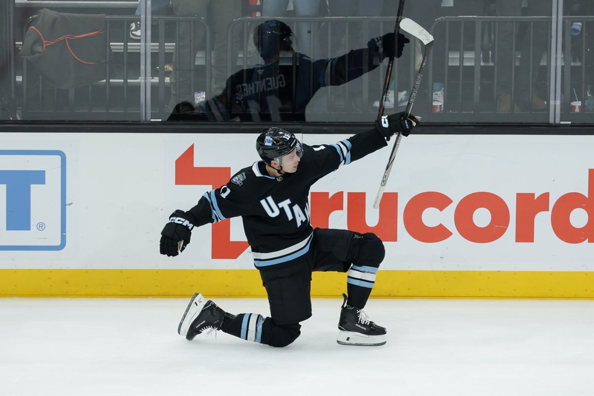 Feb 4, 2025; Salt Lake City, Utah, USA;  Utah Hockey Club right wing Dylan Guenther (11) celebrates scoring the game winning goal in overtime against the Philadelphia Flyers at Delta Center. Mandatory Credit: Chris Nicoll-Imagn Images