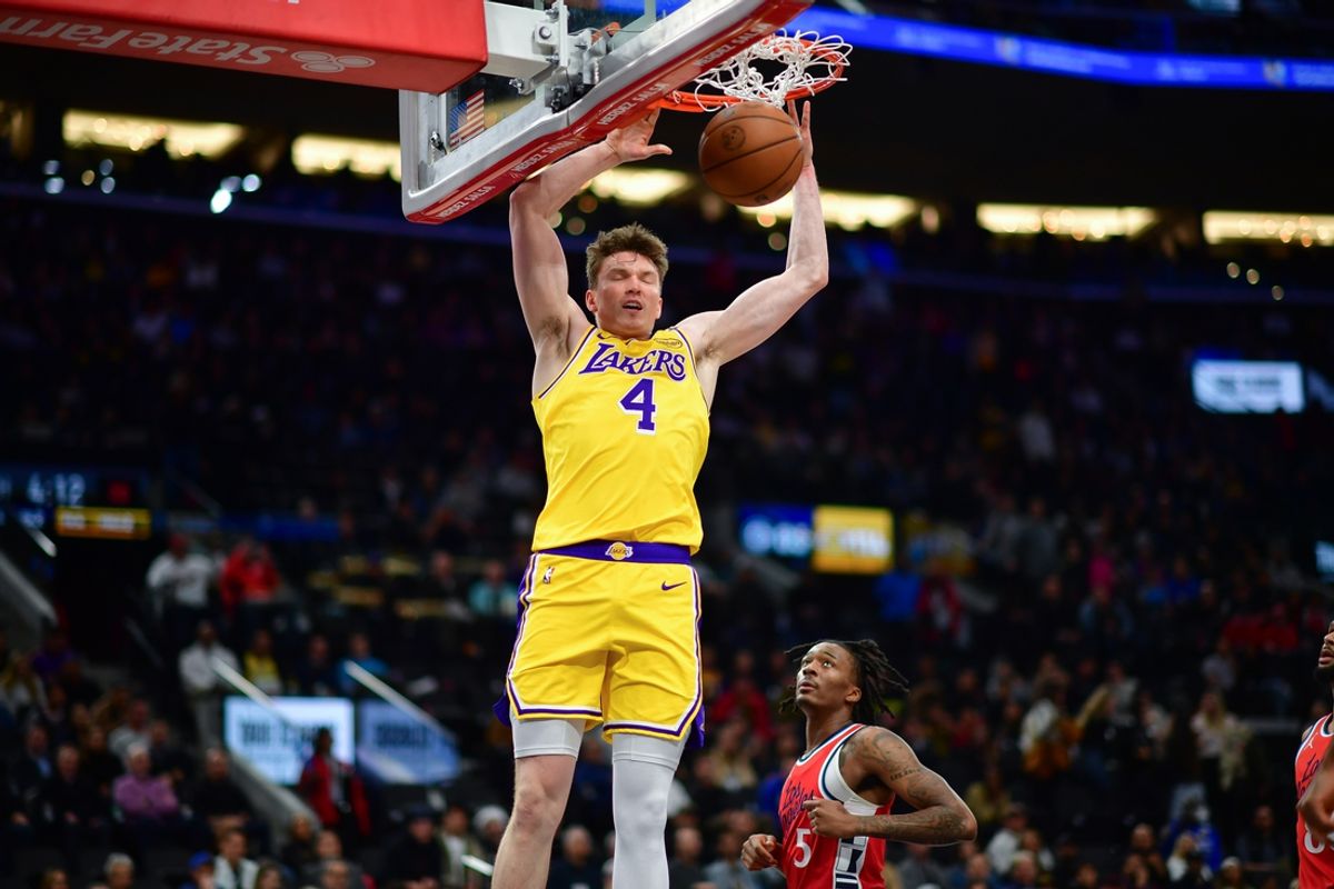 Feb 4, 2025; Inglewood, California, USA; Los Angeles Lakers guard Dalton Knecht (4) dunks for the basket against the Los Angeles Clippers during the second half at Intuit Dome. Mandatory Credit: Gary A. Vasquez-Imagn Images