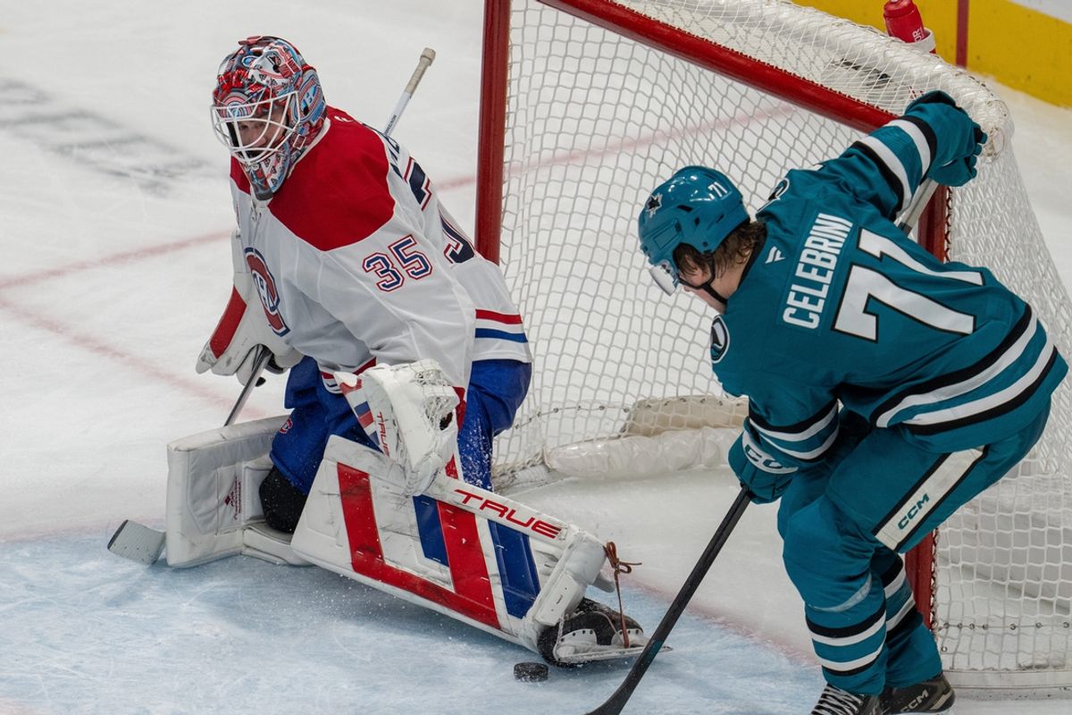 Feb 4, 2025; San Jose, California, USA;  San Jose Sharks center Macklin Celebrini (71) shot is blocked by Montreal Canadiens goaltender Sam Montembeault (35) during the third period at SAP Center at San Jose. Mandatory Credit: Neville E. Guard-Imagn Images